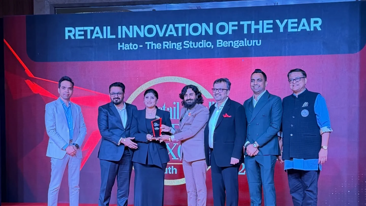 The HATO team receives the Retail Innovation of the Year award on stage, Bengaluru