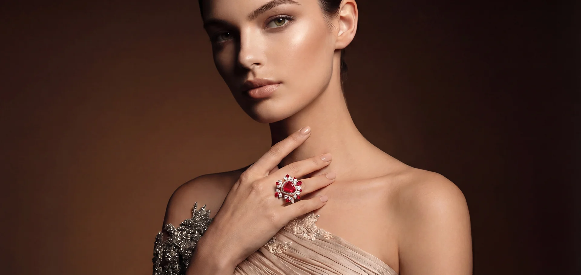 A ruby heart ring from the Evermore collection, worn at the collarbone